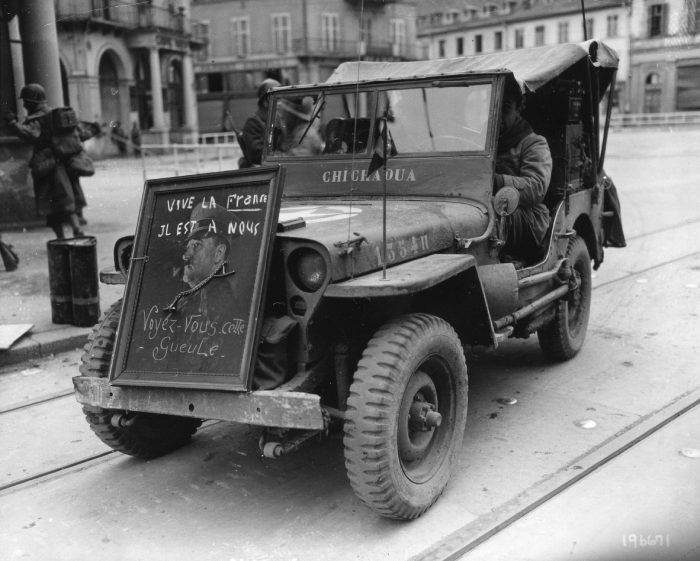 jeep decorated with a captured picture of Hitler